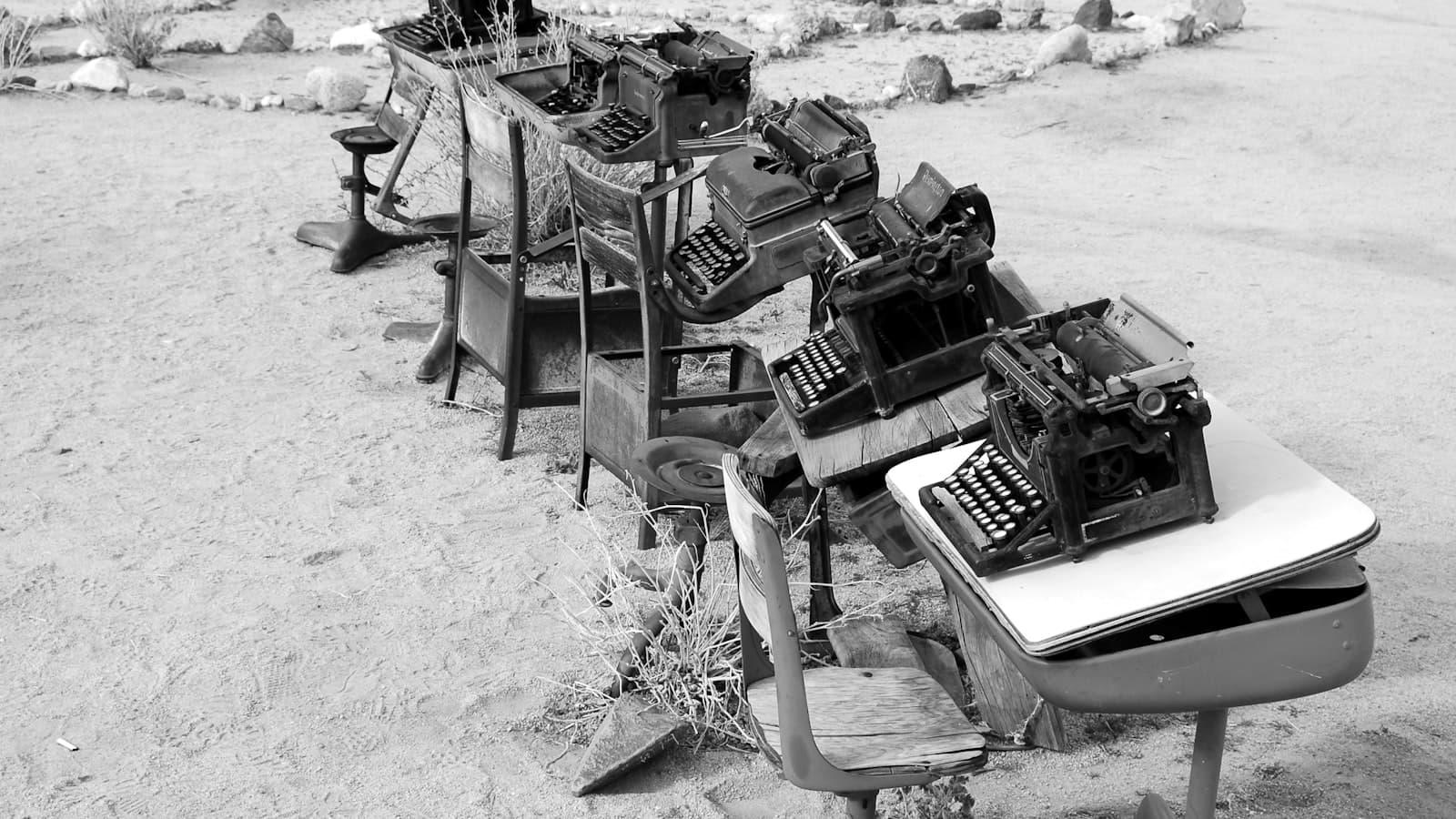 Black and white photograph of a typewriter on a desk