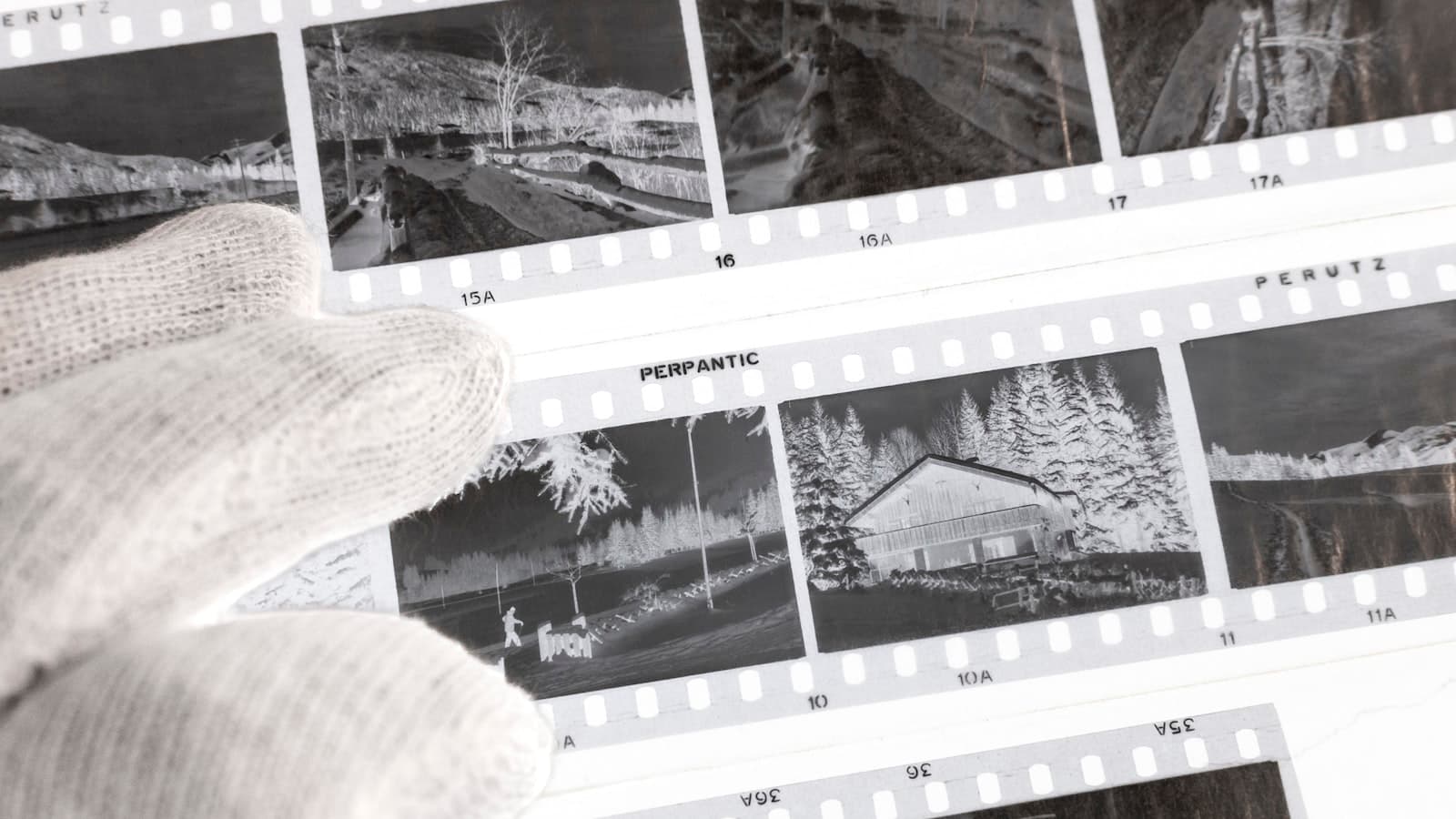 A scattered grid of polaroid photographs on a table